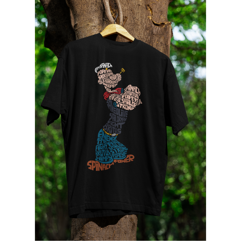 Black t-shirt with a graphic design of Popeye on a wooden hanger against a natural background.