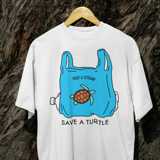 White t-shirt with a blue plastic bag and turtle graphic on a wooden hanger against a textured brown background