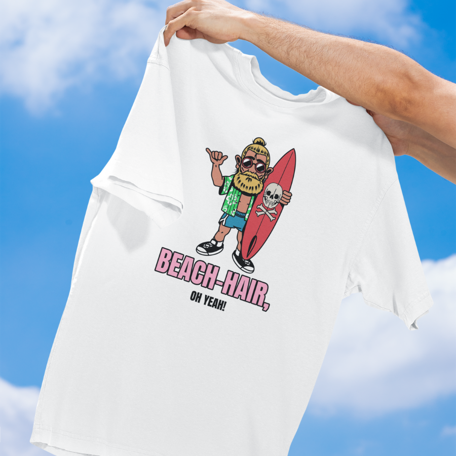 Áo thun unisex trắng và xanh dương in hình chàng trai lướt sóng tóc búi, cầm ván đầu lâu, slogan “Beach Hair, Oh Yeah!”, phong cách hài hước và streetwear mùa hè.