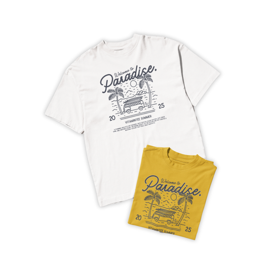 Áo thun trắng và vàng mustard in hình xe buýt giữa rặng dừa và biển, slogan “Welcome to Paradise – Vitamintee Summer 2025”, phong cách du lịch tự do và chill.