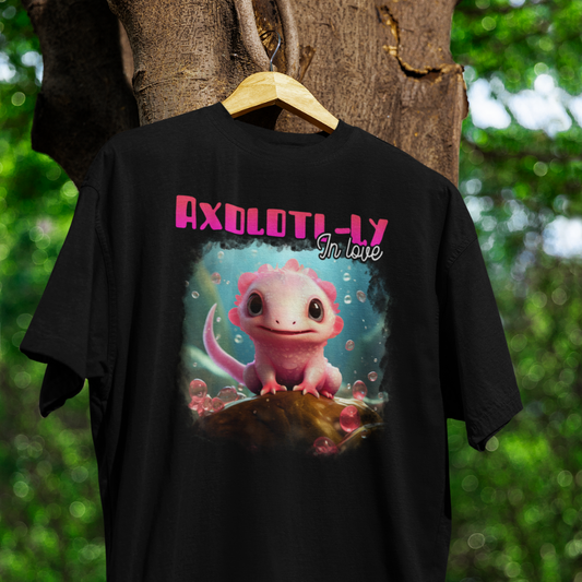 Black t-shirt with axolotl graphic and text 'Axolotly In Love' on a wooden hanger against a natural background.