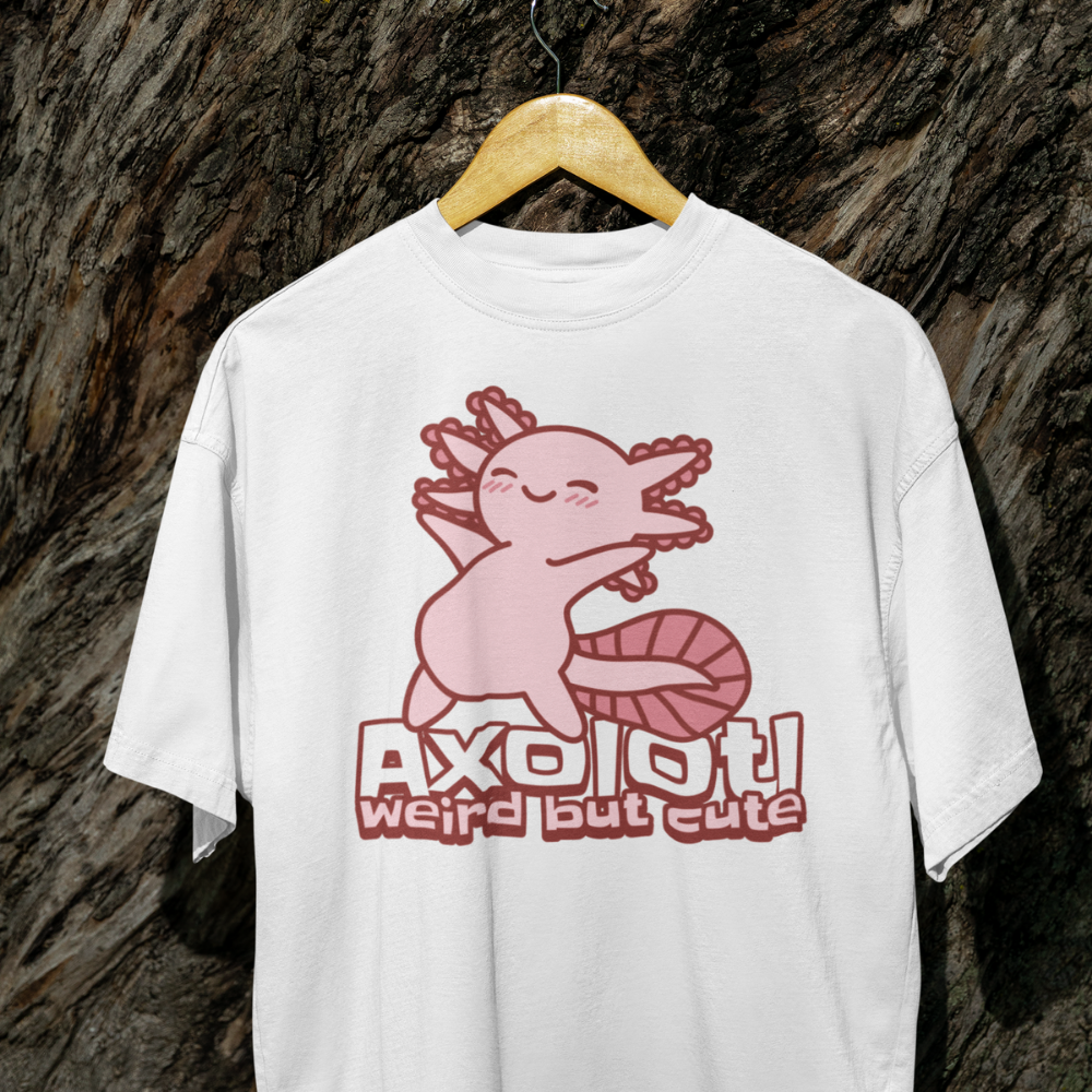 White t-shirt with pink axolotl graphic and text on a textured brown background