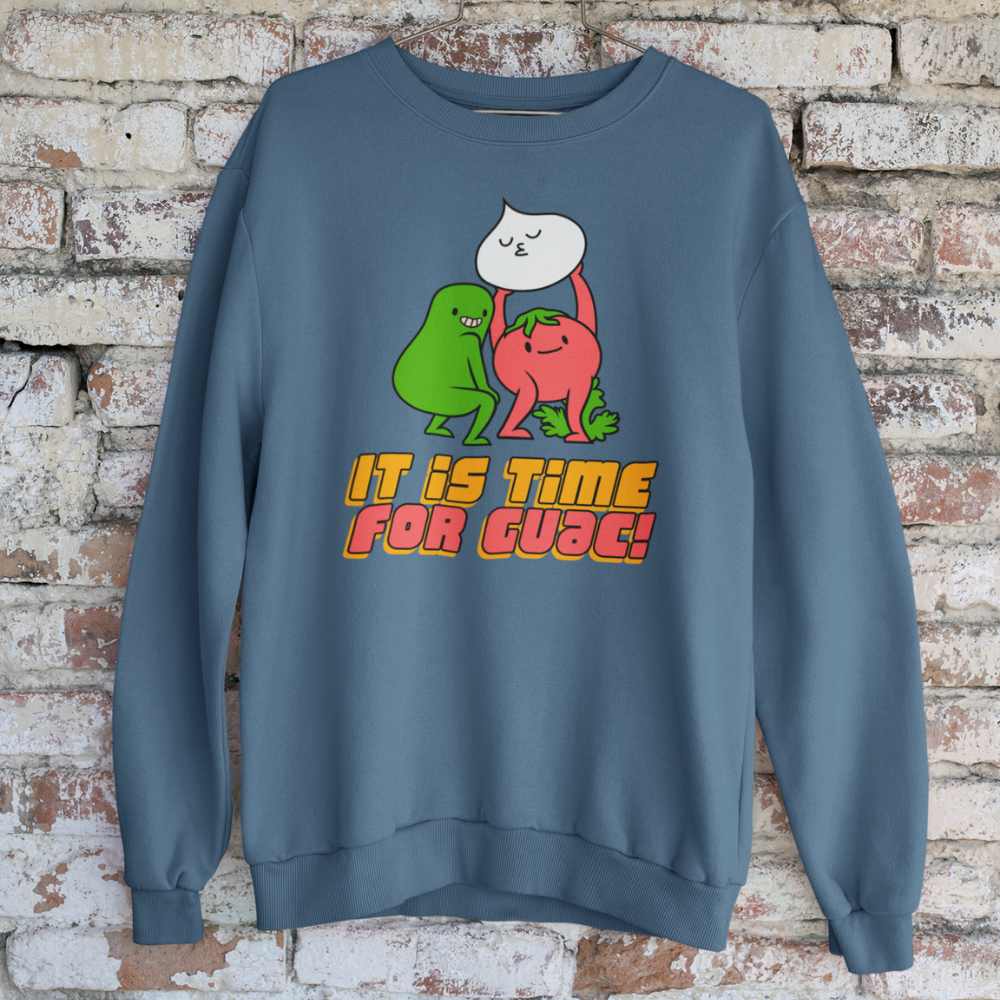Blue sweatshirt with cartoon characters and text 'It is time for guac!' against a brick wall background